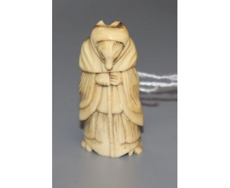 An 18th/19th century staghorn netsuke of a fox dressed as a woman