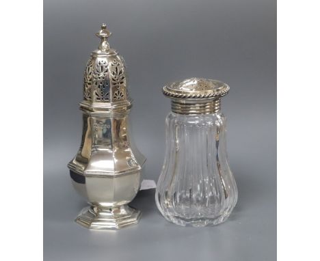 A late Victorian silver octagonal, London, 1890 caster and a German sterling mounted glass sugar caster, tallest 17.4cm,.