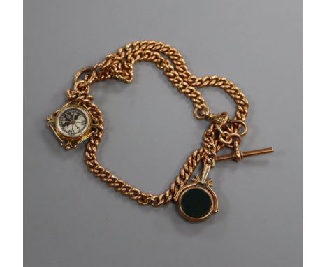 A 9ct gold curb-link watch chain with compass fob and fob seal.