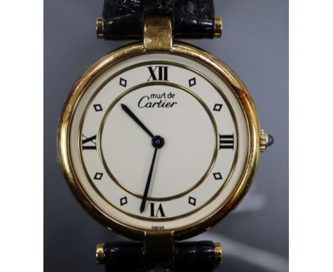 A lady's silver gilt Must de Cartier quartz wrist watch, with deployment clasp, in Cartier box.