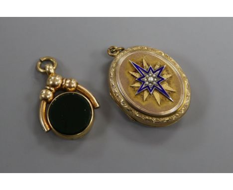 A Victorian yellow metal, seed pearl and enamel oval locket and a yellow metal, carnelian and bloodstone fob.