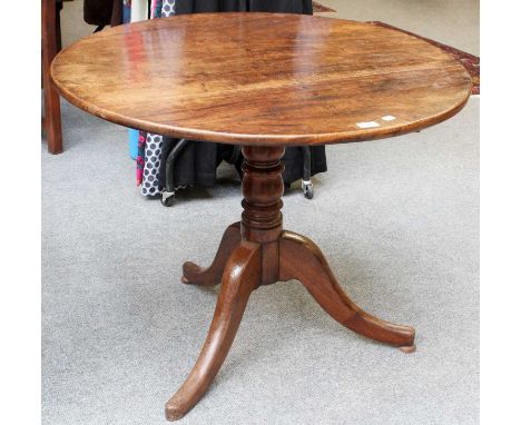 A George III Tripod Table, 87cm by 69cmTable top with visible nail head repairs across the full diameter. The top has been sp