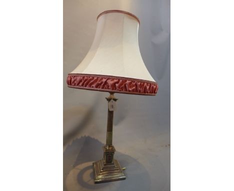 A silver plated corinthium column table lamp