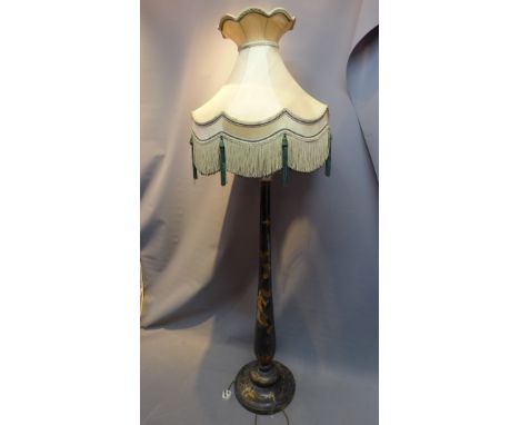  An early 20th Century Chinese black lacquered floor lamp, having original tassel shade