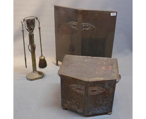 An Art Nouveau style fire guard, coal scuttle and  five tools