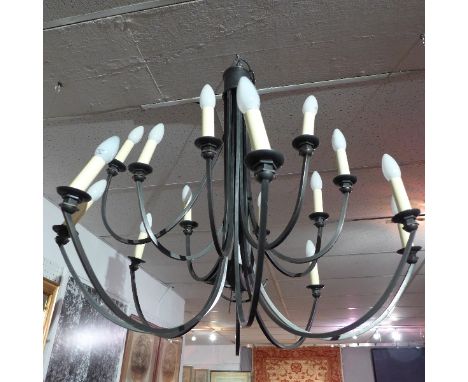 A sixteen light wrought iron chandelier by Christopher Wray.