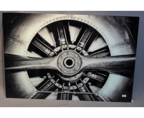 A large aviation print on glass depicting a propeller engine, H:80cm W:120cm