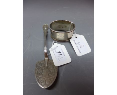 A John Lias Bros silver cheese slicer, hallmarked London, 1873/4 together with a Russian silver napkin ring