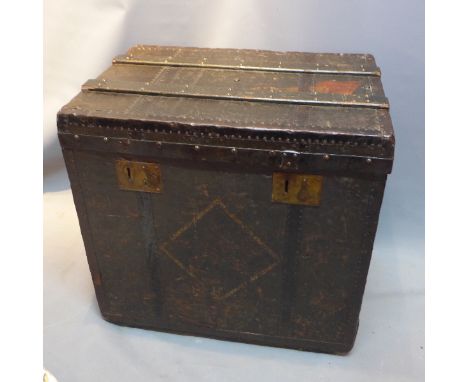 A steamer trunk having Louis Vuitton label inside