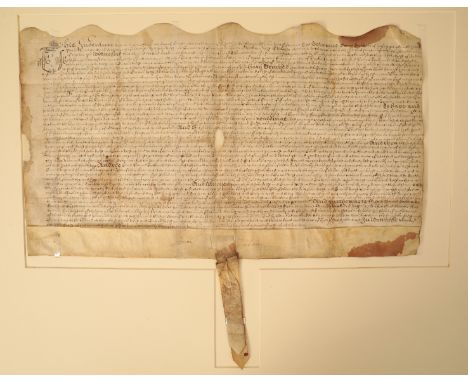 DORSET INTEREST: A HANDWRITTEN INDENTURE detailing the transfer of an estate between a Brune Dackombe of Corfe Castle and a J
