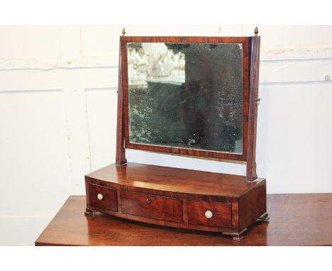 A George III mahogany dressing table rectangular mirror on bow front base with three drawers, on bracket feet, 53cm
