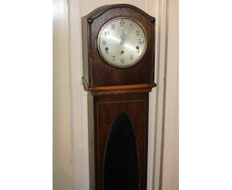 A 20th century oak grandmother clock with Westminster chimes and oval glass panel case, 141cm