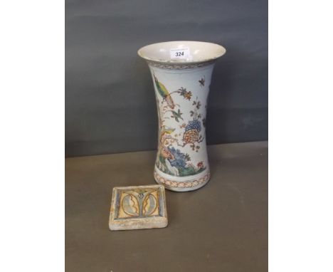 A C19th polychrome Delft vase with floral and bird decoration, and a terracotta Tuscan tile with stylised flower decoration, 