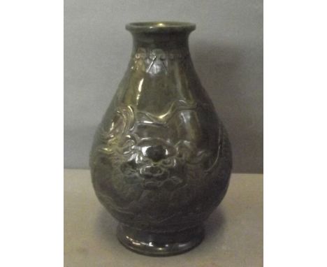 A late C19th spinach jade vase with a relief decoration of dragons, 6'' high