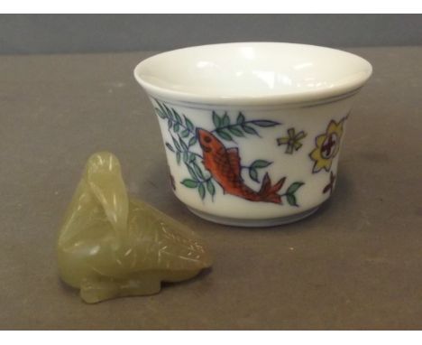 A small Doucai tea bowl decorated with fish, and a small jade figure in the form of a duckling, 1¼'' high