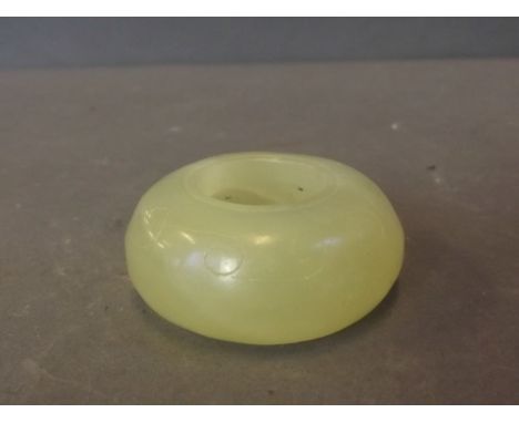 A Chinese circular light green jade water holder, 2'' diameter
