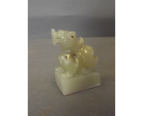 A Chinese cream jade seal with carved Fo dog knop, 2¼'' high