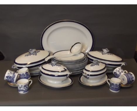 A Royal Doulton part dinner set comprising a meat plate, large ladle, two small tureens, twelve dessert plates, four dinner p