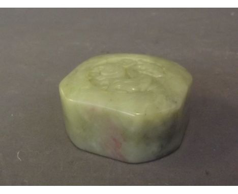 A Chinese mottled green jade seal with carved dragon decoration, 2½'' square, 1'' high