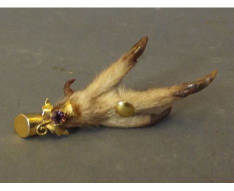 A gold mounted and amethyst set Scottish brooch in the form of a talon, 3'' long