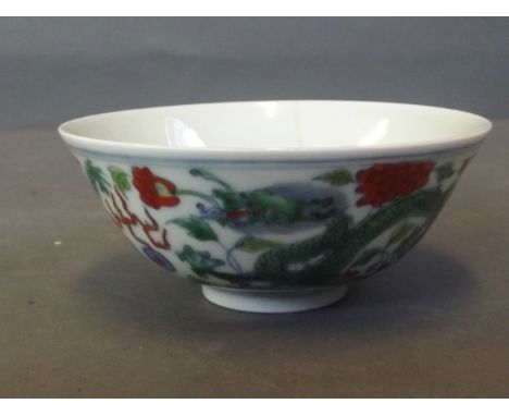 A Doucai pottery tea bowl with dragon and pearl decoration, marked, 4'' diameter (AF)