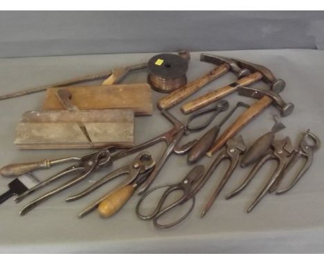 A quantity of old tools to include planes, hammers, pliers etc, and a ram's head handled cast iron poker, 19'' long