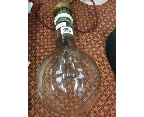 An oversized early 20th century light bulb with original fitting.
