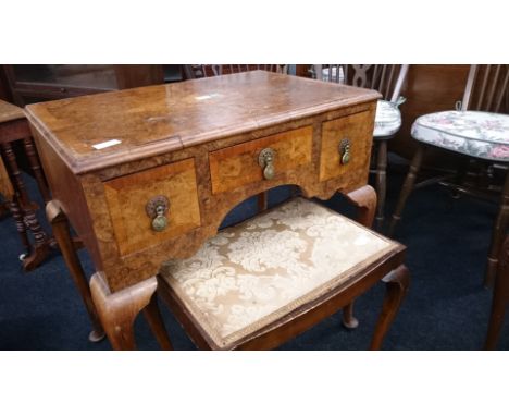 A small burr walnut quarter veneered ladies' writing desk with three drawers to front, resting on cabriole supports together 