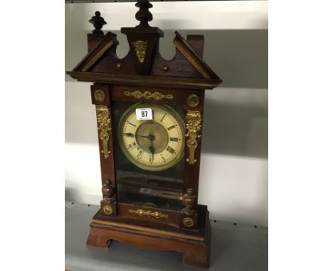 An early 20th century American wood cased mantle clock.