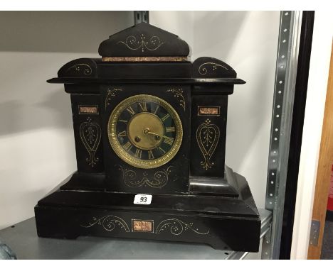 A late 19th century black slate mantle clock.
