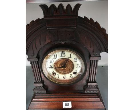 An Edwardian oak cased mantle clock.