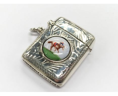 A silver and enamel effect Vesta case decorated with a Horse and Jockey.