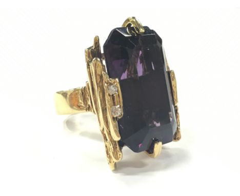 A very large handmade bespoke modernist/brutalist style ring, 18 carat gold, set with large amethyst (Approx. 60 carat with d