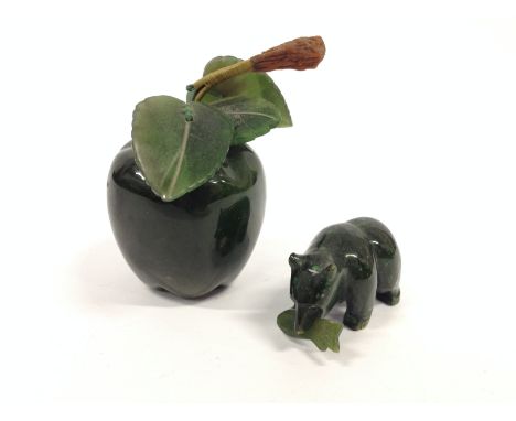 A New Zealand green stone/ British Colombian jade apple together with a small bear holding a salmon.