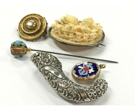 A collection of Victorian jewellery to include ivory carved flower brooch, gold topped target brooch, gold and turquoise stic