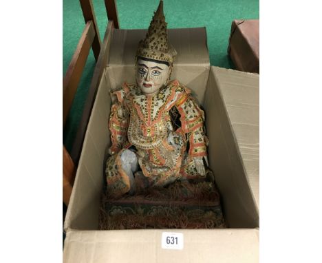 A large Eastern wooden jointed puppet in original costume.