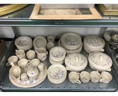 The residue of an extensive Poole Pottery breakfast service, decorated in the Springtime pattern.