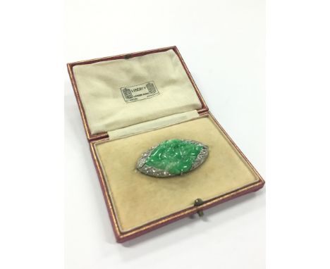 A cased Liberty of London jadeite jade and diamond set brooch.