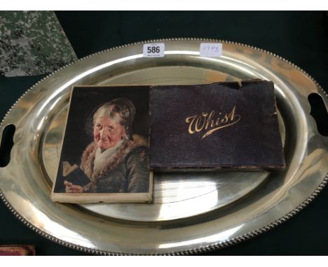An early 20th century whist playing card set together with two wooden whist markers, an oval silver plated tray and a small o