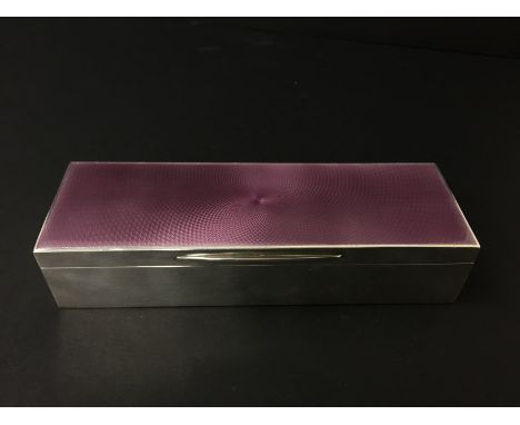 An Asprey & Co. silver and enamel lidded rectangular jewellery box with gilded interior: London 1913.