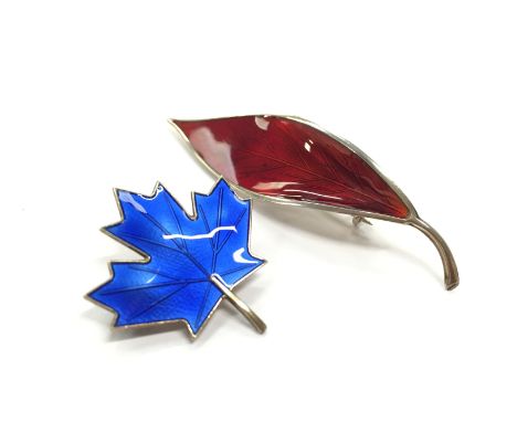 Two silver and enamel leaf brooches, one by Aksel Holmsen and one by David Andersen.