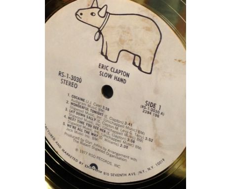 Eric Clapton: A framed gold disc; presented to Z-108FM to commemorate the sale of more than 500,000 copies of the RSO Records