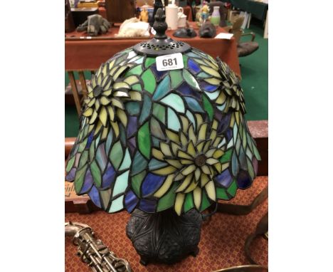 A reproduction Tiffany style table lamp base with floral mosaic glass shade.