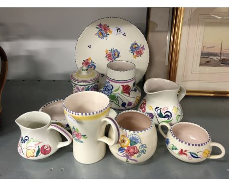 A collection of various white bodied Poole Pottery items.