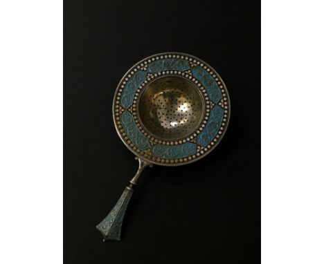 A 20th century Swedish silver and enamel tea strainer.