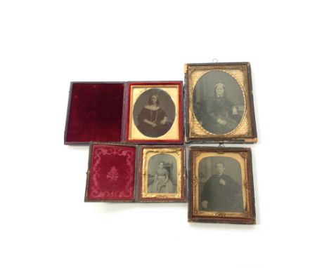 Four various Daguerreotype style portrait photographs in original frames (including two folding).