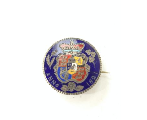 A 19th century enamel decorated silver half Crown, dated 1821.