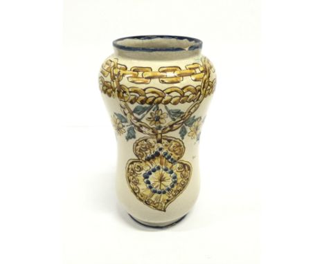 An Italian hand painted Albarello with inscription and medallion with painted floral hanging decoration.