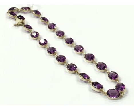 A Victorian silver gilt and amethyst paste necklace.