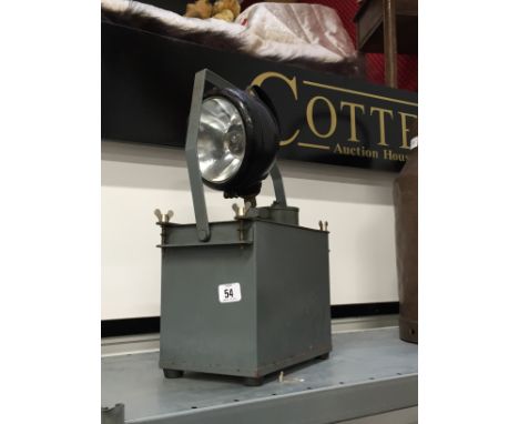 A mid 20th century portable search light.